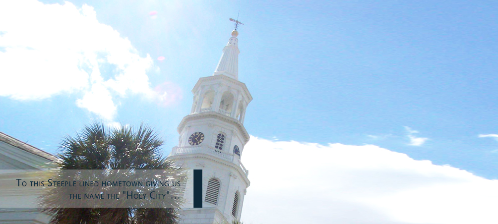 A white church steeple with a clock on it.